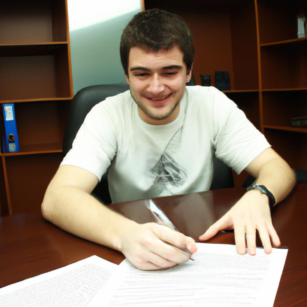 Person signing publishing contract, smiling
